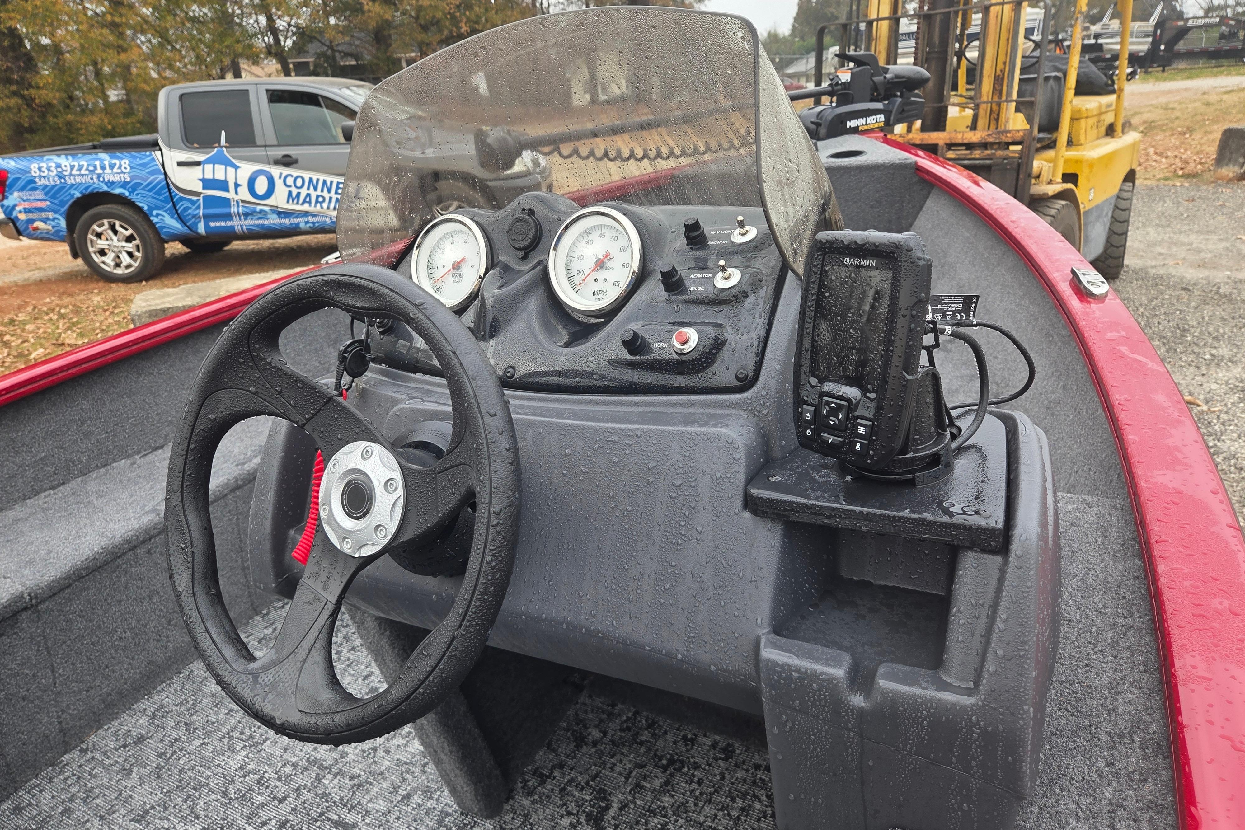 2025 Tracker Super Guide V-16 SC boat dashboard with steering wheel and gauges.