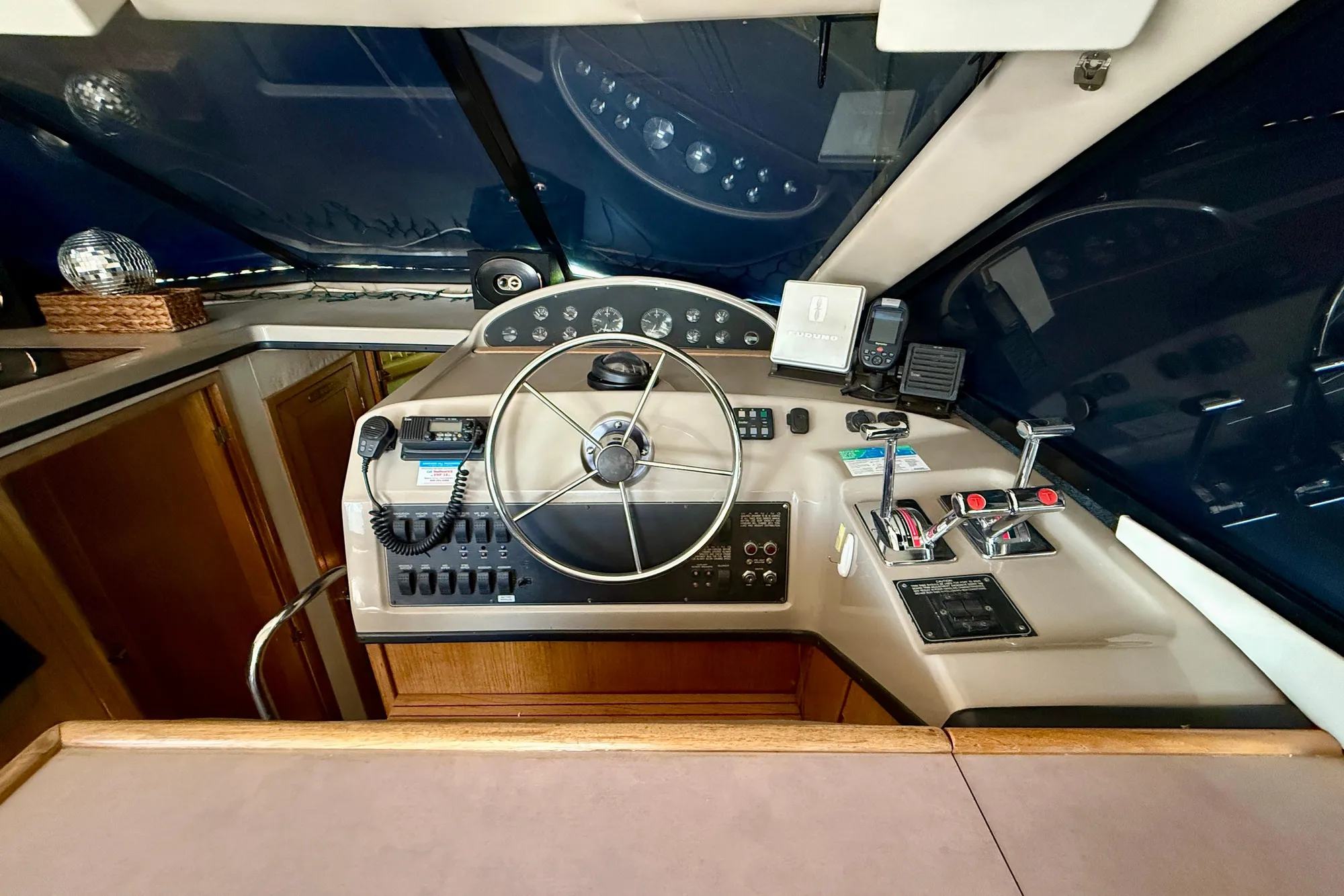 1998 Bayliner 3988 Command Bridge Motoryacht helm with steering wheel and navigation controls.