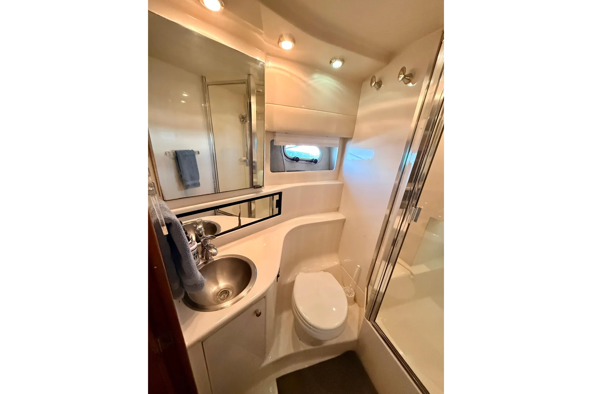 1998 Bayliner 3988 Command Bridge Motoryacht bathroom with sink, toilet, and shower.