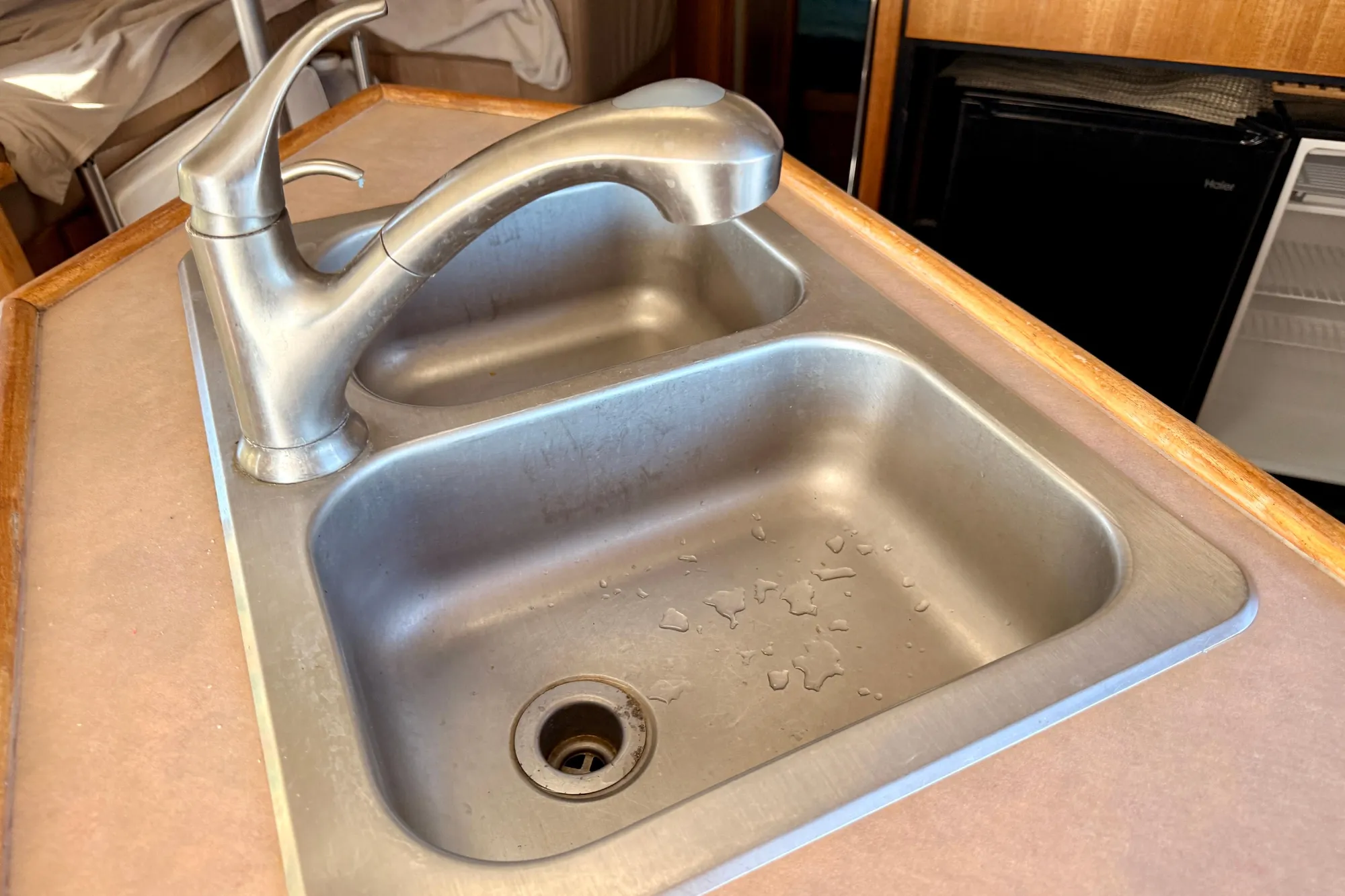Stainless steel sink in 1998 Bayliner 3988 Command Bridge Motoryacht kitchen area.