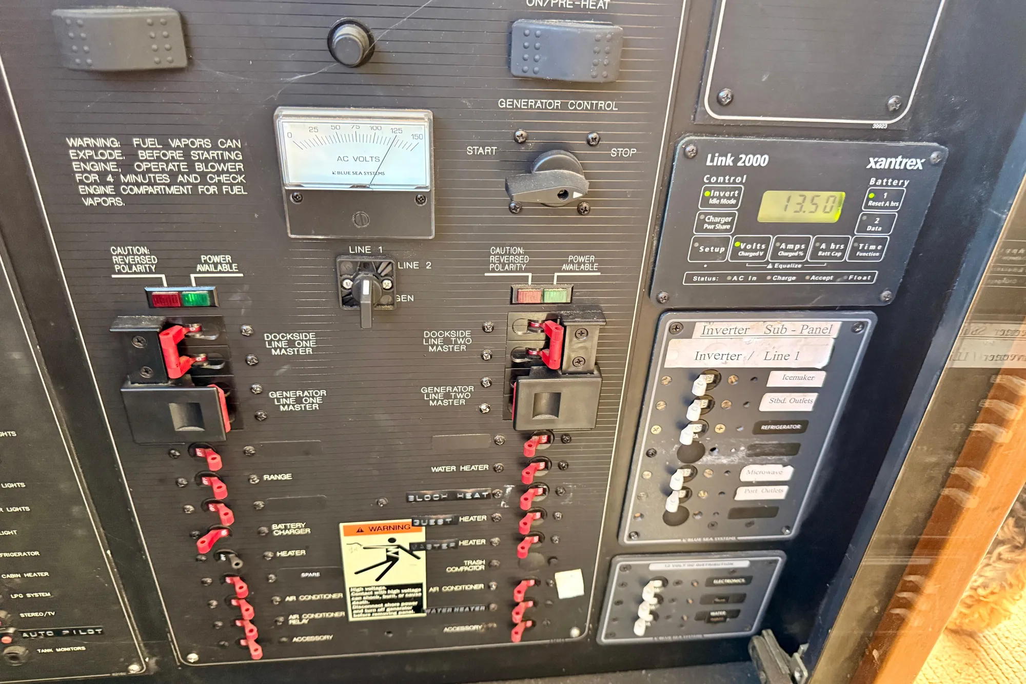Electrical control panel of a 1998 Bayliner 3988 Command Bridge Motoryacht with various switches and meters.