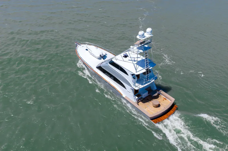  Yacht Photos Pics Aerial view of 1998 Donzi R73 yacht cruising on open water.