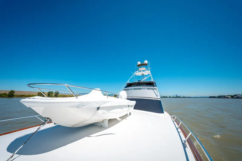  Yacht Photos Pics 1998 Donzi R73 yacht cruising on a sunny day with clear blue skies.