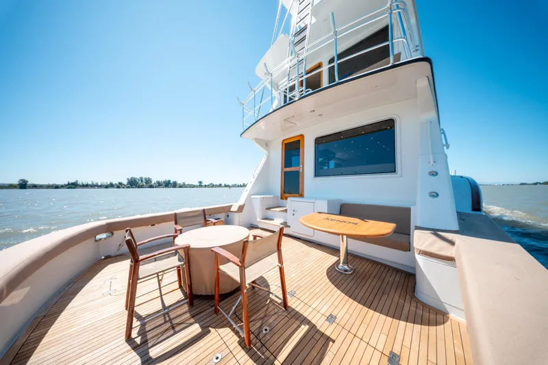  Yacht Photos Pics 1998 Donzi R73 yacht deck with seating area, cruising on a sunny day.