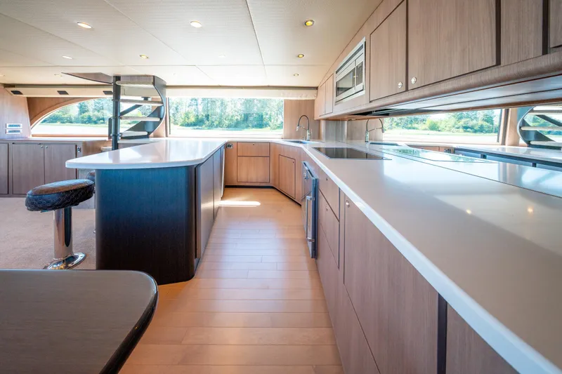  Yacht Photos Pics Luxurious kitchen interior of 1998 Donzi R73 yacht with modern design and ample natural light.
