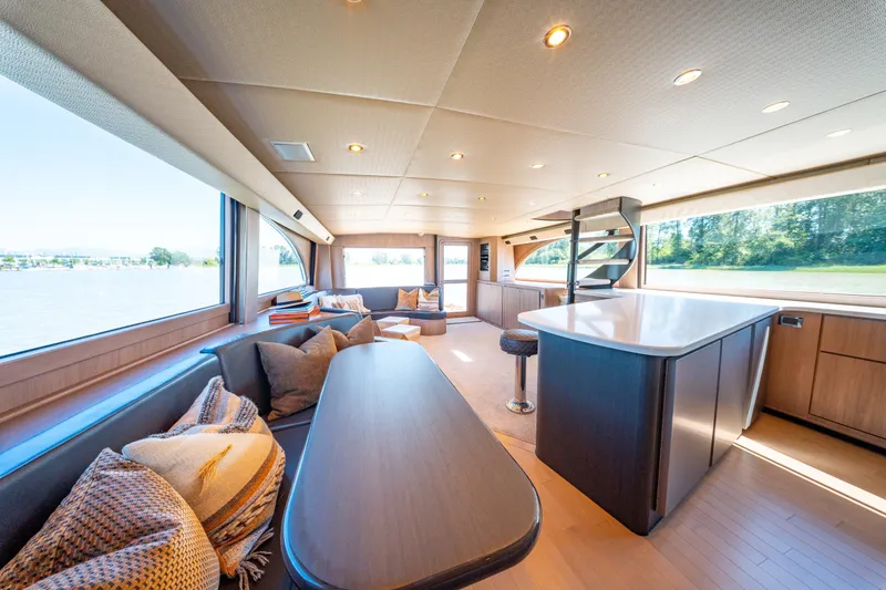  Yacht Photos Pics Luxurious interior of a 1998 Donzi R73 yacht with modern seating and panoramic windows.