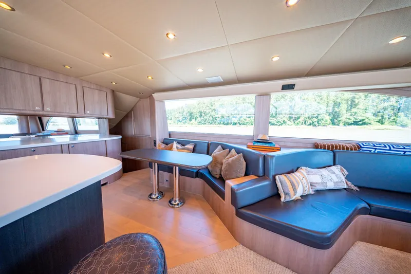  Yacht Photos Pics Luxurious interior of 1998 Donzi R73 yacht with modern seating and elegant decor.