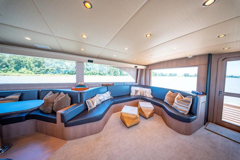  Yacht Photos Pics Luxurious interior of 1998 Donzi R73 yacht with plush seating and scenic window views.