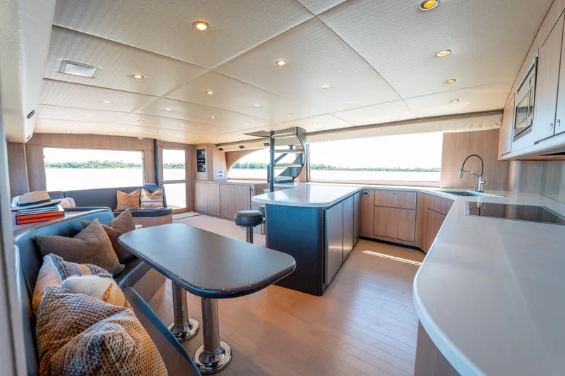  Yacht Photos Pics Luxurious interior of a 1998 Donzi R73 yacht with modern kitchen and seating area.