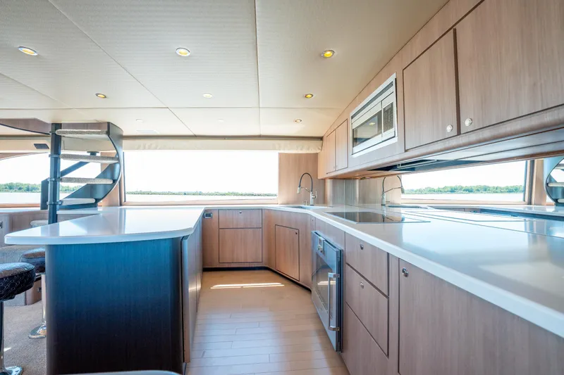 Yacht Photos Pics Luxurious kitchen interior of 1998 Donzi R73 yacht with modern appliances and sleek design.