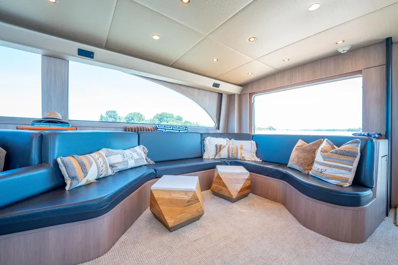  Yacht Photos Pics Luxurious interior of 1998 Donzi R73 yacht with plush seating and stylish decor.