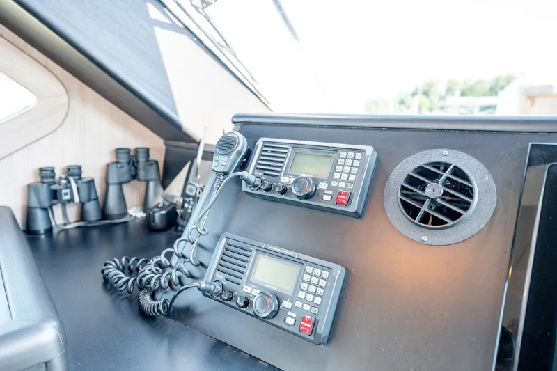  Yacht Photos Pics Control panel of 1998 Donzi R73 yacht with communication radios and binoculars.