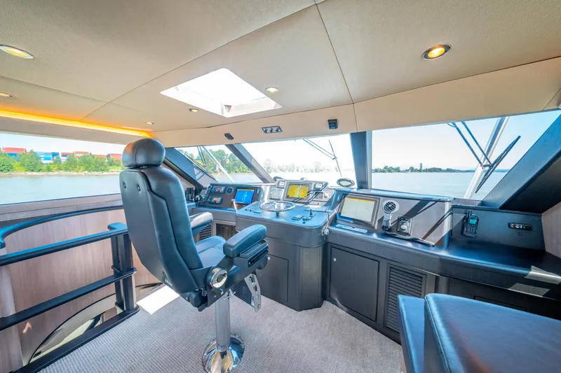  Yacht Photos Pics Luxurious 1998 Donzi R73 yacht helm with modern navigation equipment and panoramic water views.