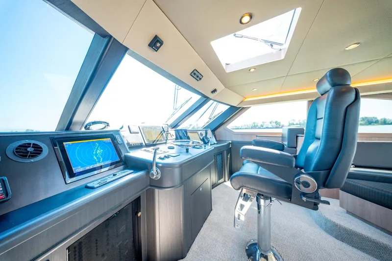  Yacht Photos Pics Luxurious 1998 Donzi R73 yacht cockpit with advanced navigation systems and plush seating.