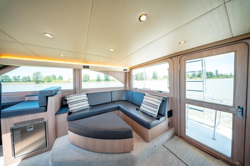  Yacht Photos Pics Luxurious interior of 1998 Donzi R73 yacht with modern seating and scenic windows.