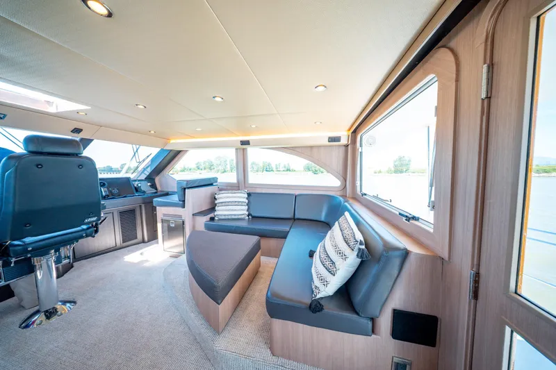  Yacht Photos Pics Luxurious interior of a 1998 Donzi R73 yacht with modern seating and helm.