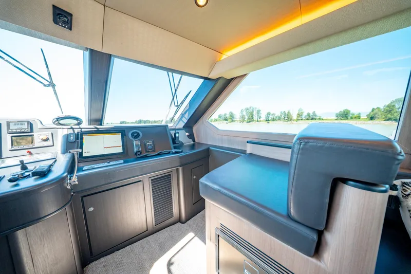  Yacht Photos Pics Interior of 1998 Donzi R73 yacht cockpit with modern navigation equipment.