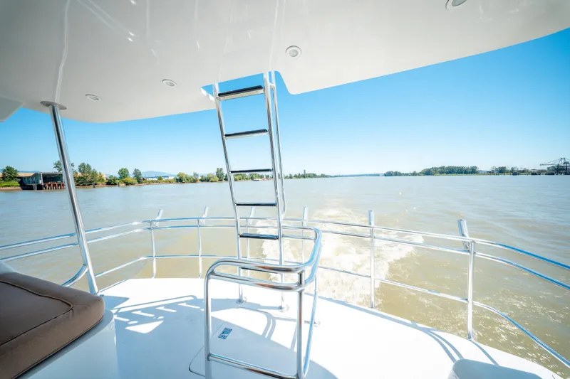  Yacht Photos Pics 1998 Donzi R73 yacht deck with ladder, cruising on a sunny day.