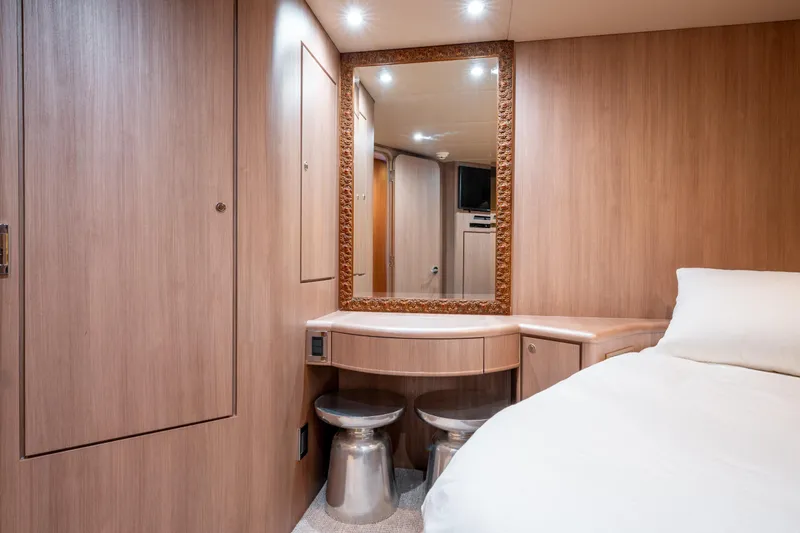  Yacht Photos Pics Luxurious 1998 Donzi R73 yacht cabin with elegant wood paneling and vanity mirror.