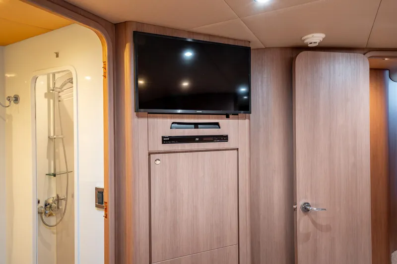  Yacht Photos Pics Interior of 1998 Donzi R73 yacht with TV and shower area.