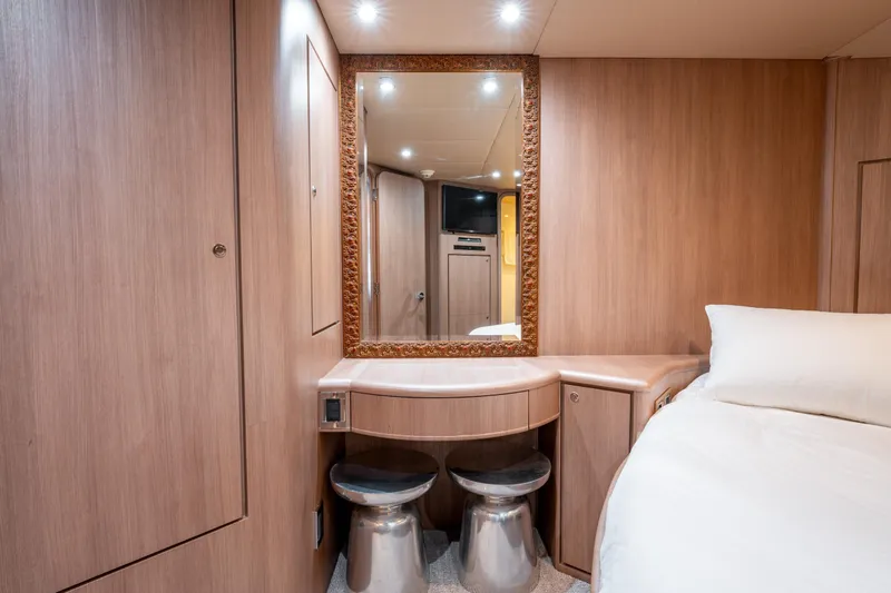  Yacht Photos Pics Luxurious 1998 Donzi R73 yacht cabin with elegant wood paneling and vanity mirror.