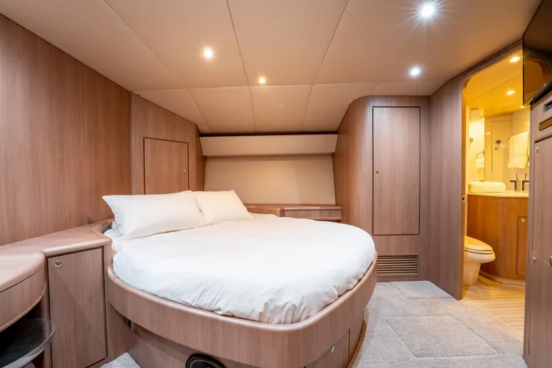  Yacht Photos Pics Luxurious bedroom interior of 1998 Donzi R73 yacht with ensuite bathroom.