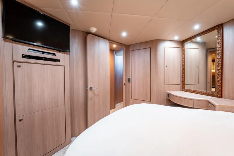  Yacht Photos Pics Luxurious interior of 1998 Donzi R73 yacht with modern amenities and elegant wood finish.