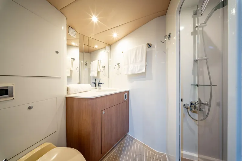  Yacht Photos Pics Luxurious bathroom in a 1998 Donzi R73 yacht, featuring modern fixtures and elegant design.
