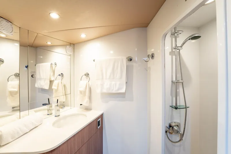  Yacht Photos Pics Luxurious bathroom interior of 1998 Donzi R73 yacht with modern fixtures and shower.