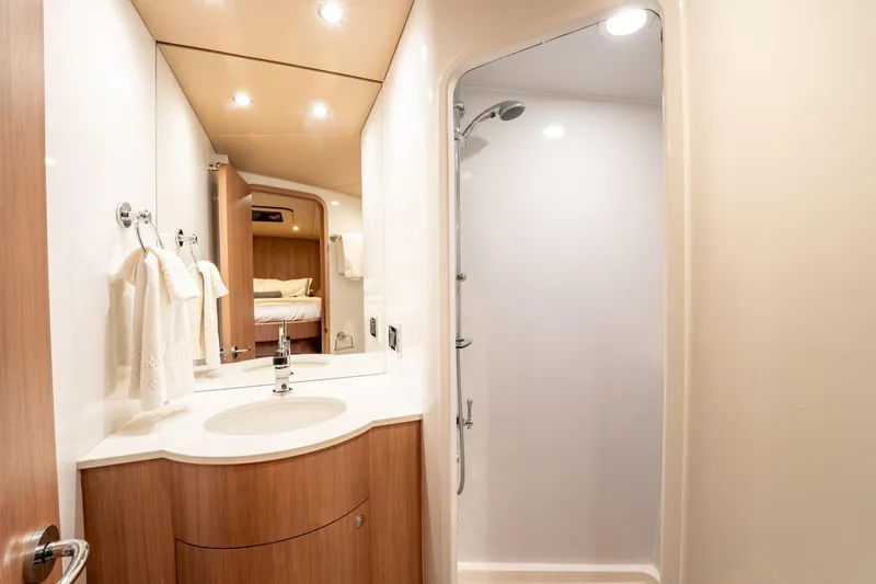  Yacht Photos Pics Luxurious bathroom interior of 1998 Donzi R73 yacht with modern fixtures and shower.