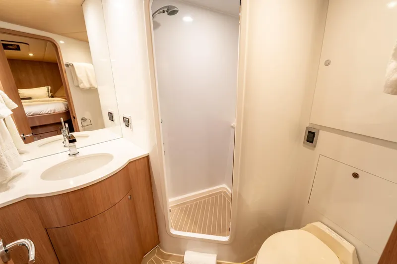  Yacht Photos Pics Luxurious bathroom interior of 1998 Donzi R73 yacht with shower and vanity.