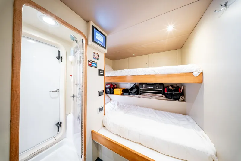  Yacht Photos Pics Interior of 1998 Donzi R73 yacht with bunk beds and bathroom.