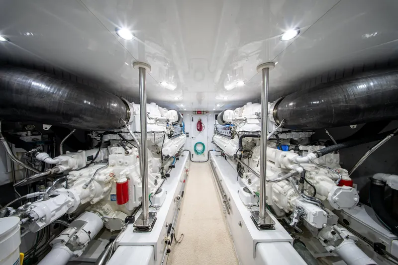  Yacht Photos Pics Engine room of a 1998 Donzi R73 yacht, featuring dual engines and sleek design.