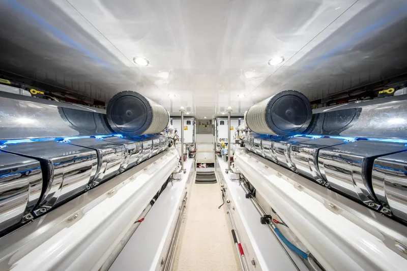  Yacht Photos Pics Engine room of a 1998 Donzi R73 yacht, featuring polished metal components.