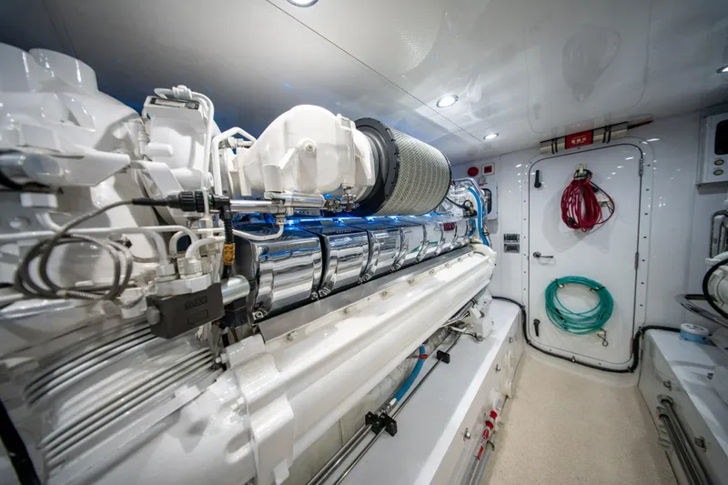  Yacht Photos Pics Engine room of a 1998 Donzi R73 yacht, featuring advanced machinery and organized equipment.