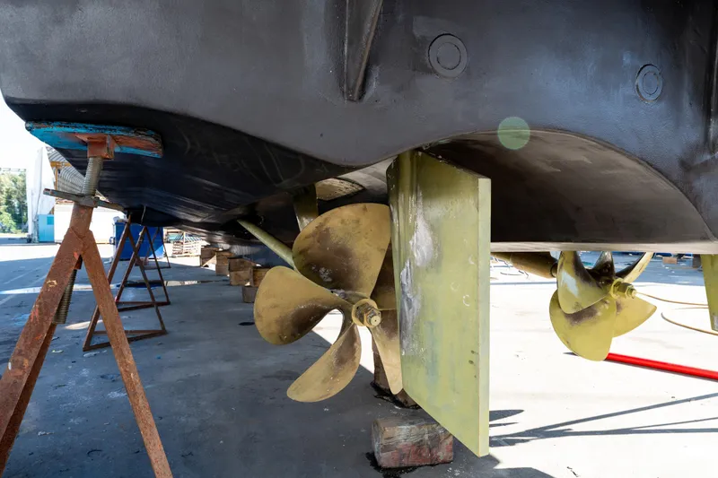  Yacht Photos Pics 1998 Donzi R73 yacht under maintenance, showcasing propellers and rudders.