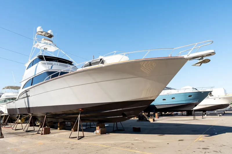  Yacht Photos Pics 1998 Donzi R73 yacht on dry dock, showcasing sleek design and sturdy construction.