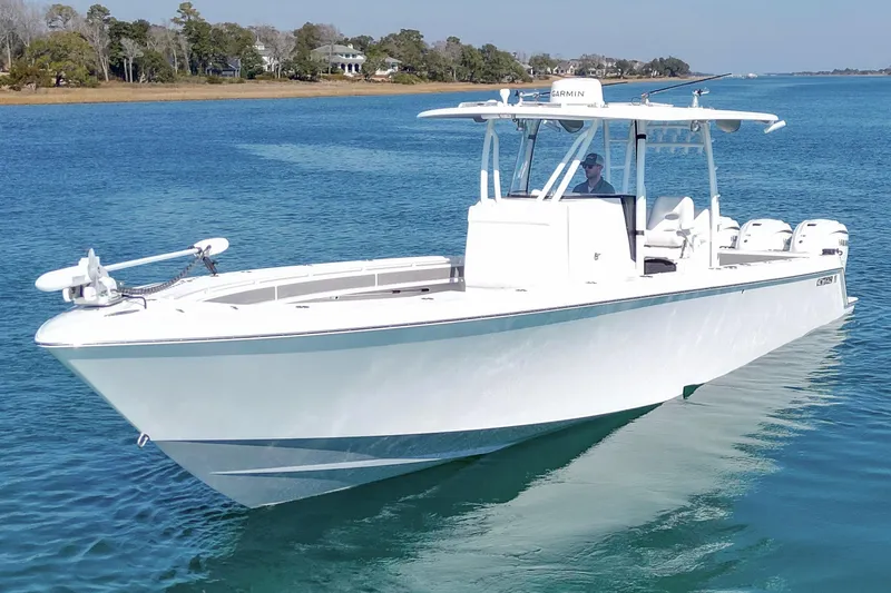  Yacht Photos Pics 2024 Contender 39 ST boat cruising on clear blue water.