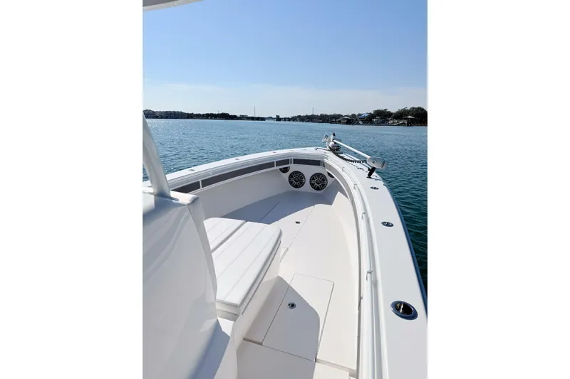  Yacht Photos Pics 2024 Contender 39 ST boat on calm water, showcasing sleek design and spacious deck.