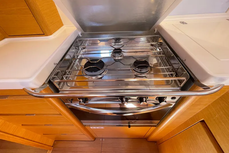  Yacht Photos Pics Modern kitchen stove in 2018 X-Yachts X4.9 sailboat, featuring sleek stainless steel design.