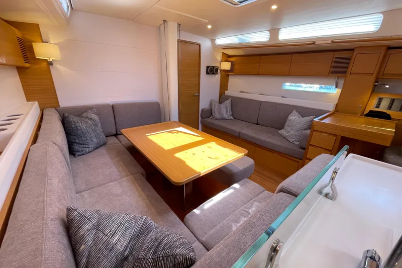  Yacht Photos Pics Luxurious interior of 2018 X-Yachts X4.9 with modern seating and wooden accents.