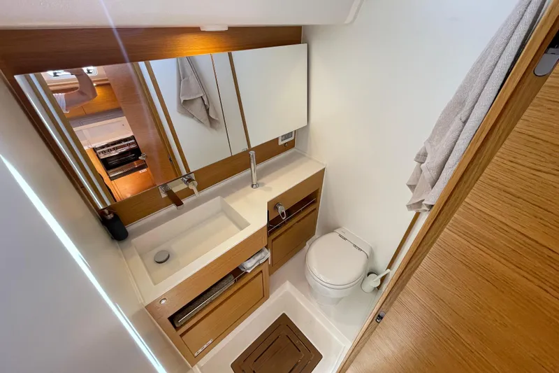  Yacht Photos Pics Luxurious bathroom in 2018 X-Yachts X4.9, featuring modern sink and toilet.