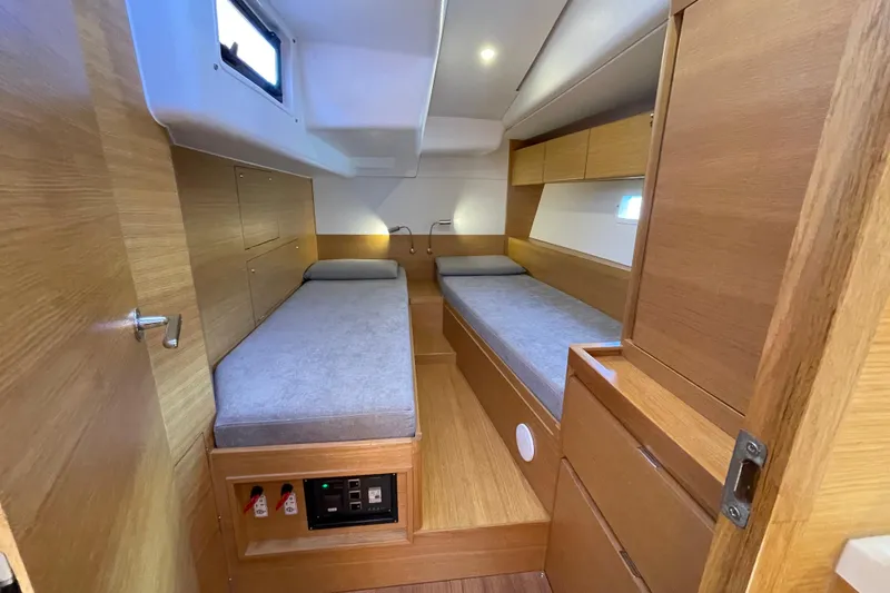  Yacht Photos Pics Interior of 2018 X-Yachts X4.9 featuring twin beds and wooden cabinetry.