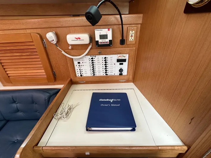 Wakes Yacht Photos Pics Control panel and owner's manual in a 2005 Catalina 36 MkII yacht interior.