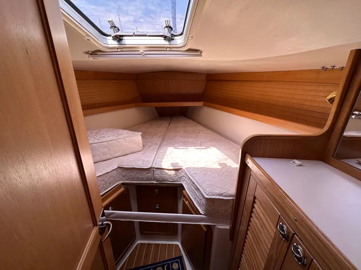 Wakes Yacht Photos Pics Cozy cabin interior of 2005 Catalina 36 MkII sailboat with wooden finishes and skylight.