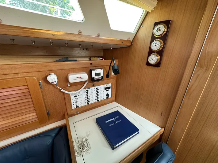 Wakes Yacht Photos Pics Interior of 2005 Catalina 36 MkII sailboat with navigation station and owner's manual.