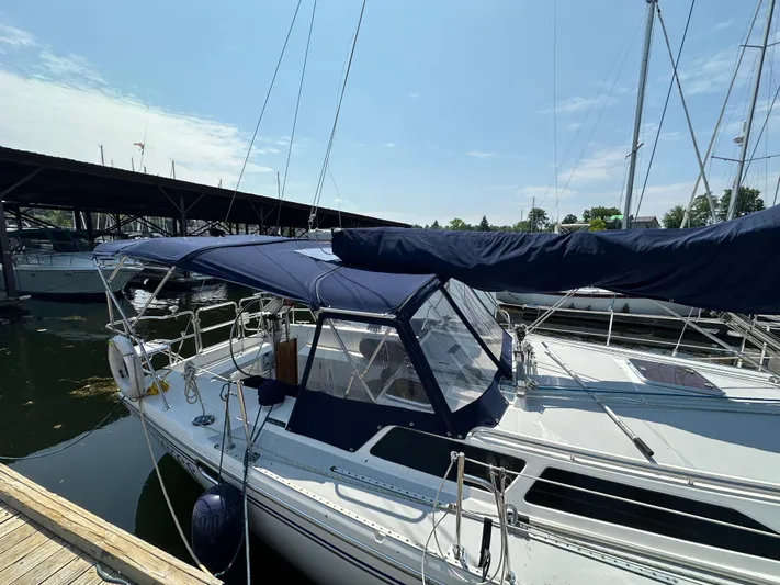 Wakes Yacht Photos Pics Catalina 36 MkII 2005 sailboat docked, featuring blue canvas covers and sleek design.