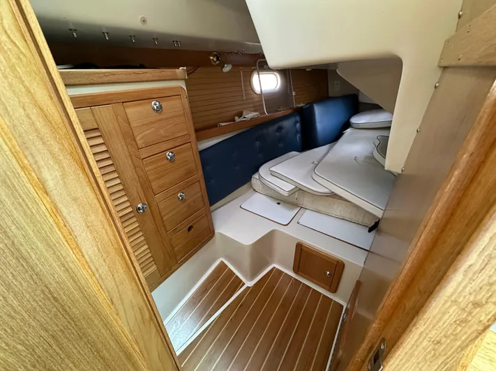 Wakes Yacht Photos Pics Interior of 2005 Catalina 36 MkII sailboat with wooden cabinetry and cushioned seating.
