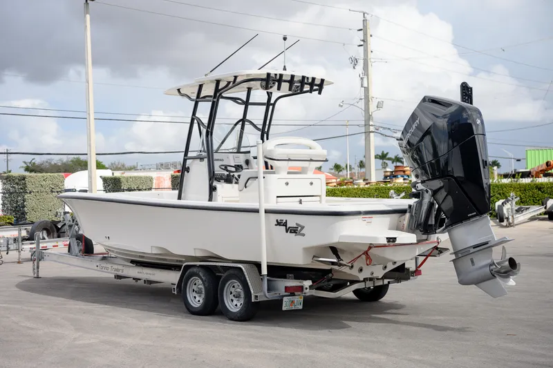  Yacht Photos Pics 2024 SeaVee 270Z boat on trailer, featuring a powerful outboard motor.