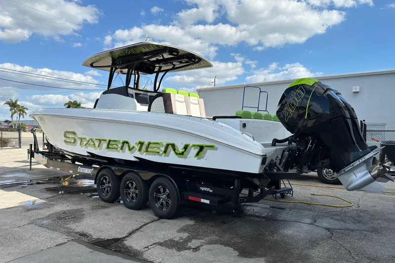  Yacht Photos Pics 2017 Statement 350 Open boat on trailer, featuring powerful outboard engines.